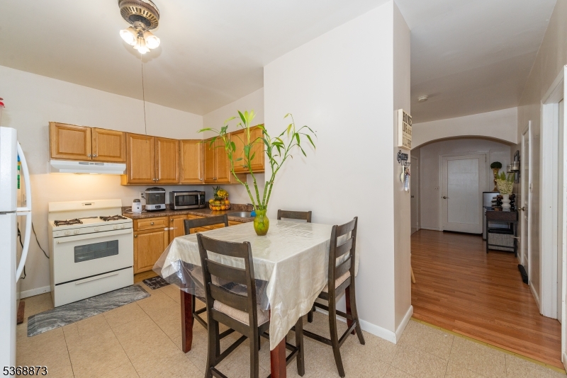 609 Madison Avenue, Unit 2 Paterson, NJ 07514 - Photo 27 of 43 a kitchen with a table and chairs in it
