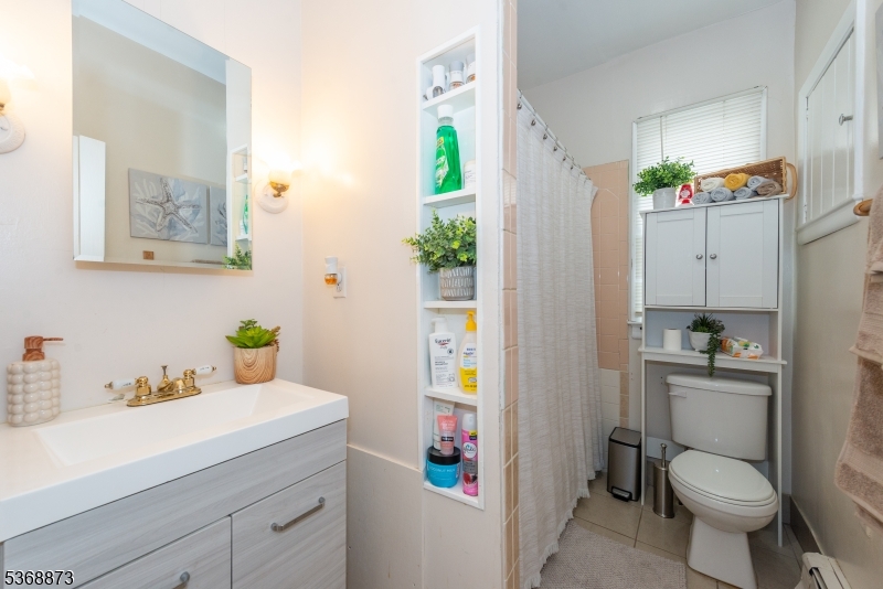 609 Madison Avenue, Unit 2 Paterson, NJ 07514 - Photo 30 of 43 a bathroom with a sink toilet and shower