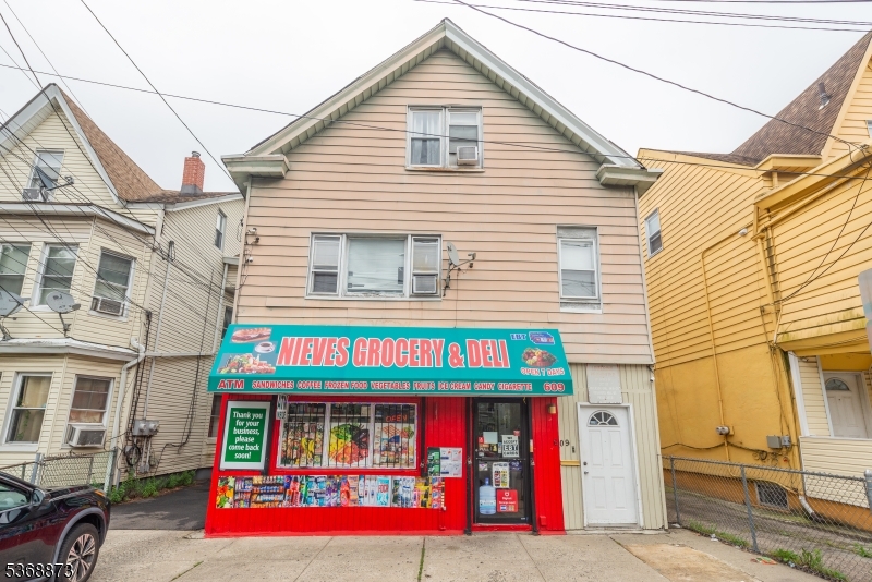 609 Madison Avenue, Unit 2 Paterson, NJ 07514 - Photo 3 of 43 a view of small white building