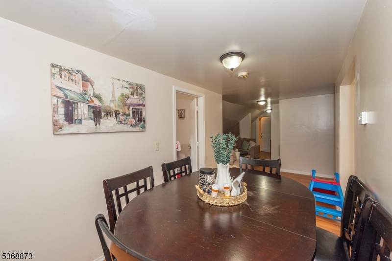 609 Madison Avenue, Unit 2 Paterson, NJ 07514 - Photo 37 of 43 a view of a dining room with furniture