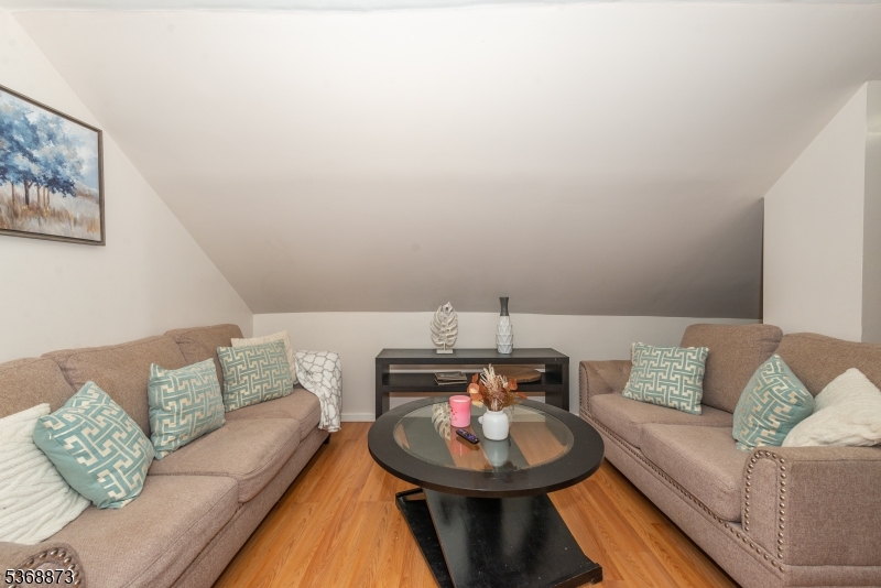 609 Madison Avenue, Unit 2 Paterson, NJ 07514 - Photo 41 of 43 a living room with furniture and a couch