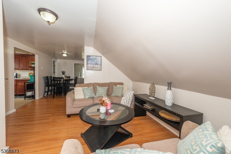 609 Madison Avenue, Unit 2 Paterson, NJ 07514 - Photo 43 of 43 a living room with furniture and wooden floor