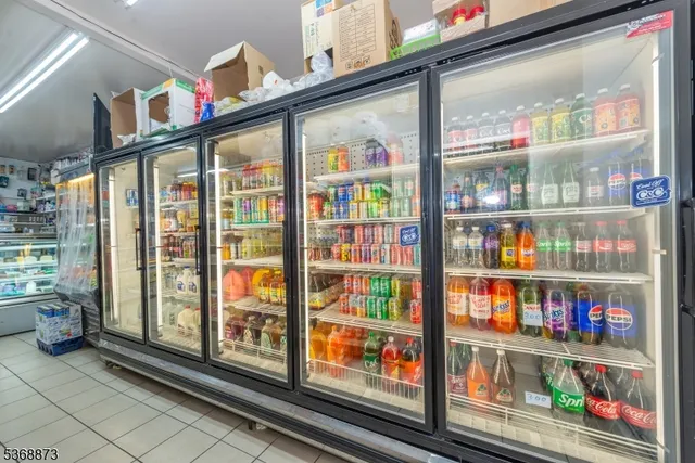a view of a brick house with a large windows and a large tree