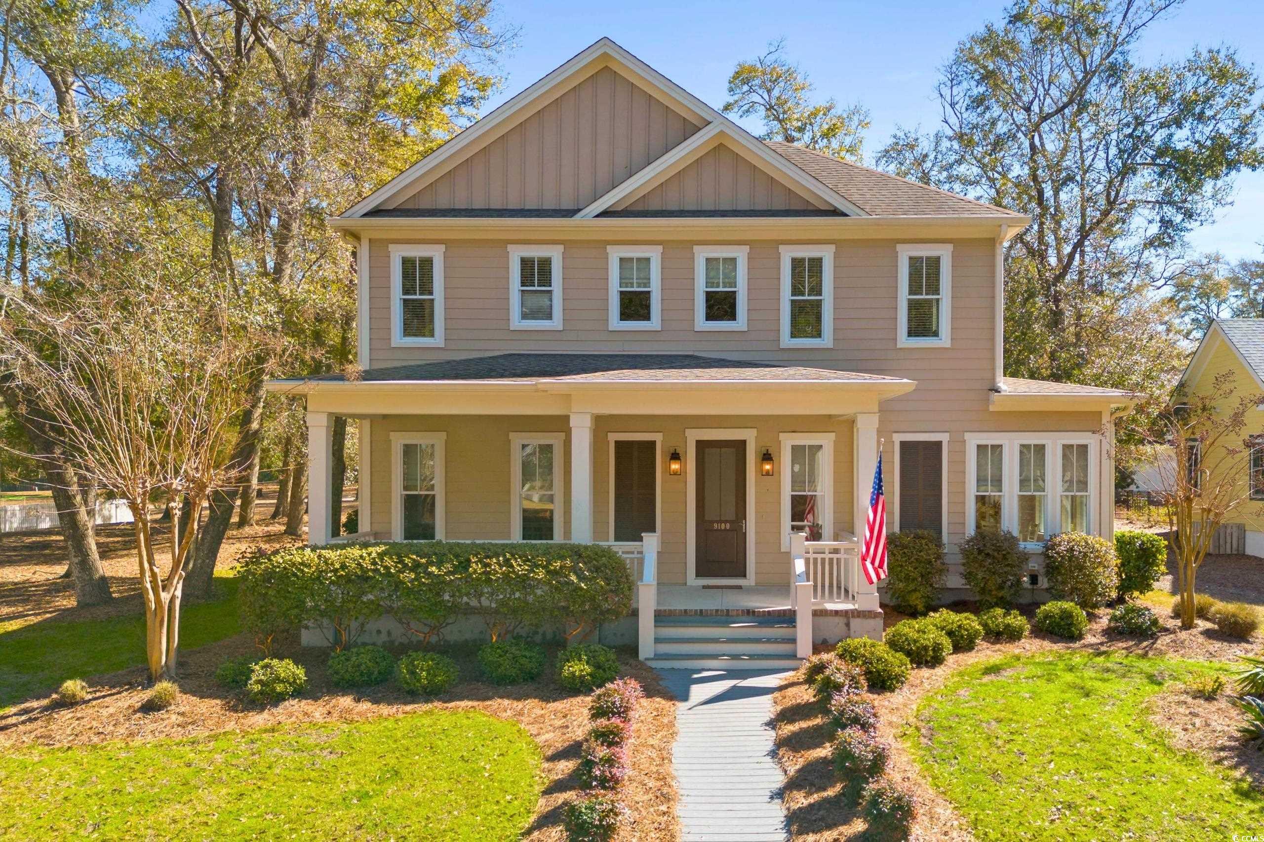 9100 Fountain Street Southwest Calabash, NC 28467 - Photo 2 of 40 View of front of property featuring board and batten siding and covered porch