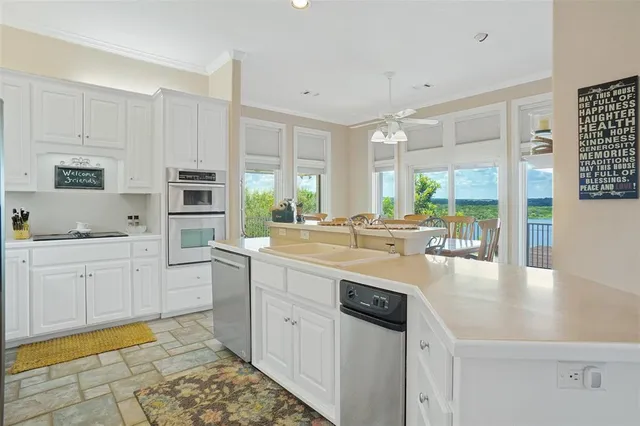 a kitchen with counter top space and appliances