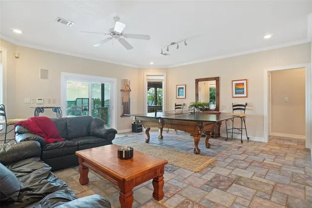 a living room with furniture a window and a table