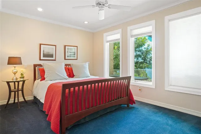 a bedroom with bed and a window