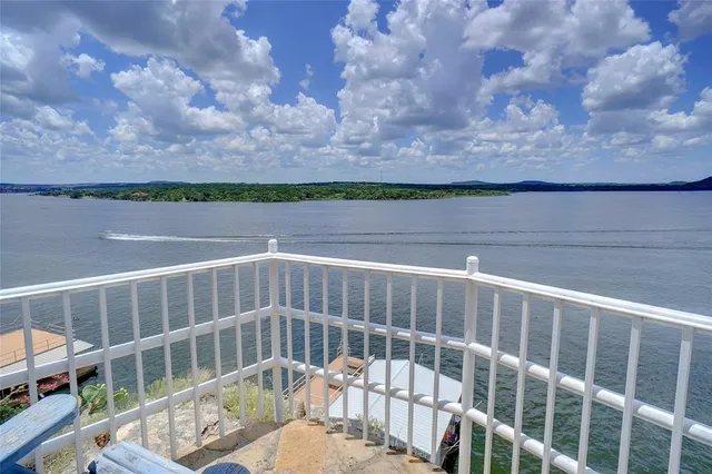 a view of balcony with wooden floor