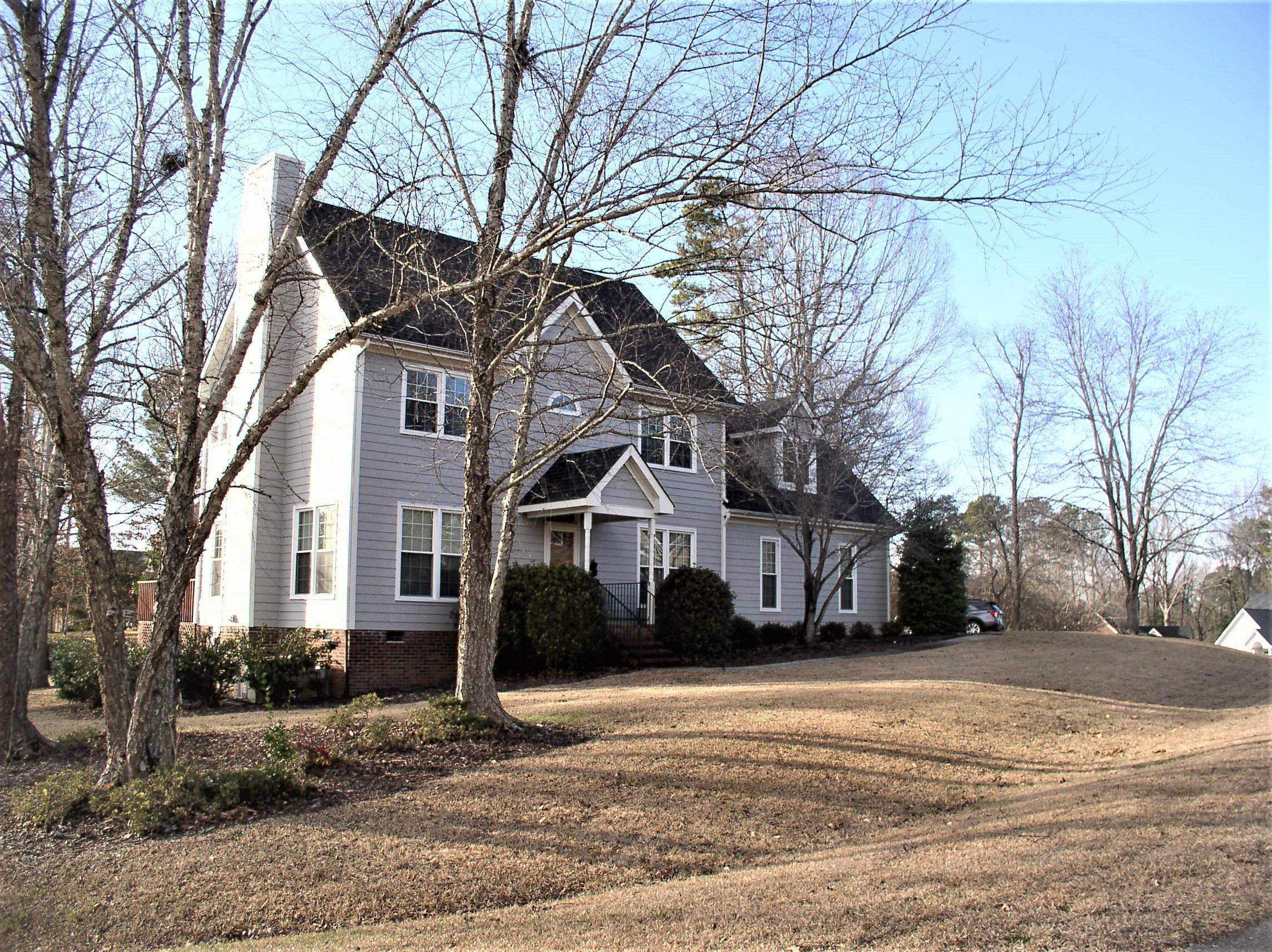 3516 Kapalua Way Raleigh, NC 27610 - Photo 1 of 42 a front view of a house with a yard and garage
