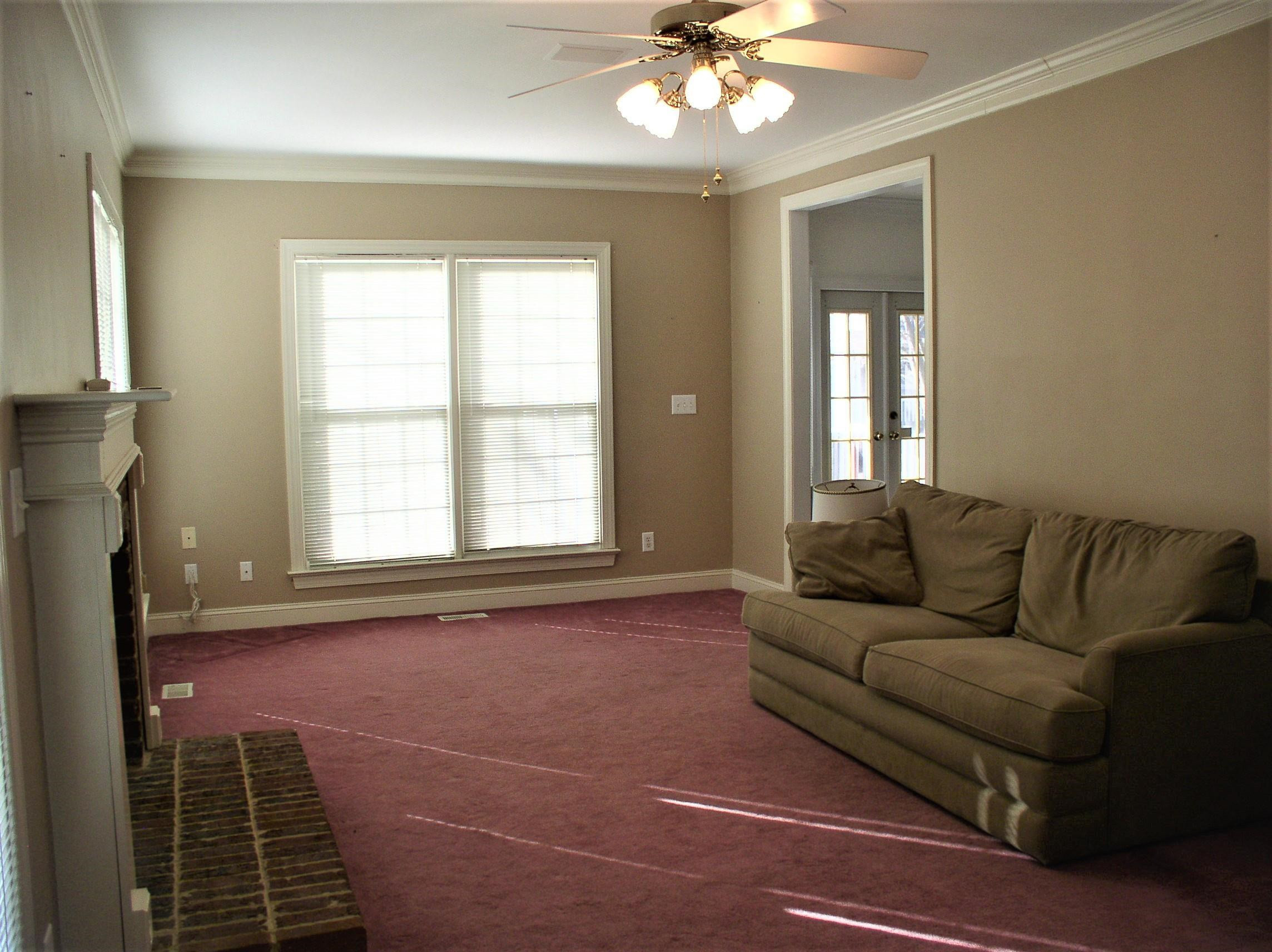 3516 Kapalua Way Raleigh, NC 27610 - Photo 12 of 42 a living room with furniture and a large window