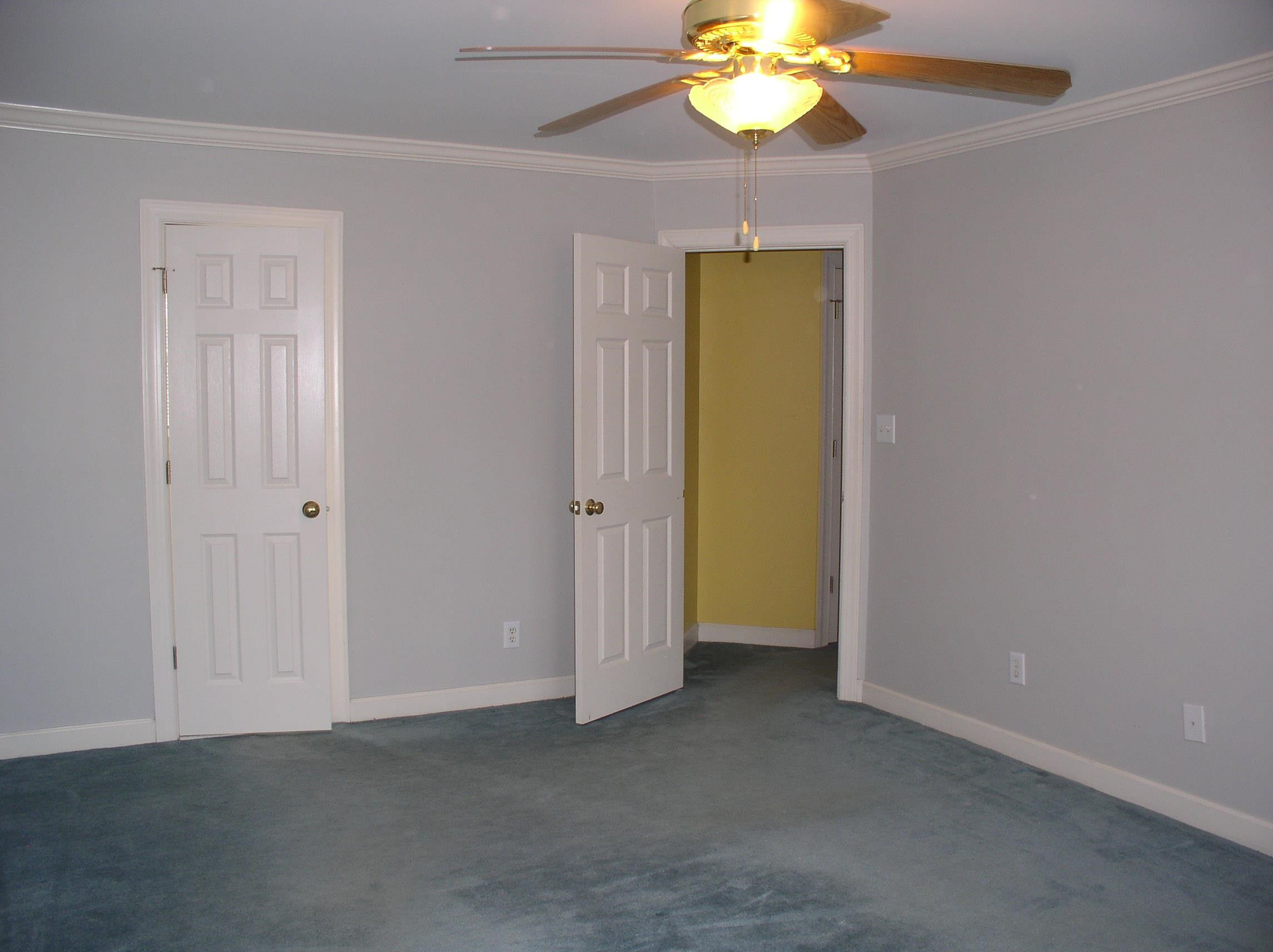 3516 Kapalua Way Raleigh, NC 27610 - Photo 17 of 42 an empty room with a mirror and a fan
