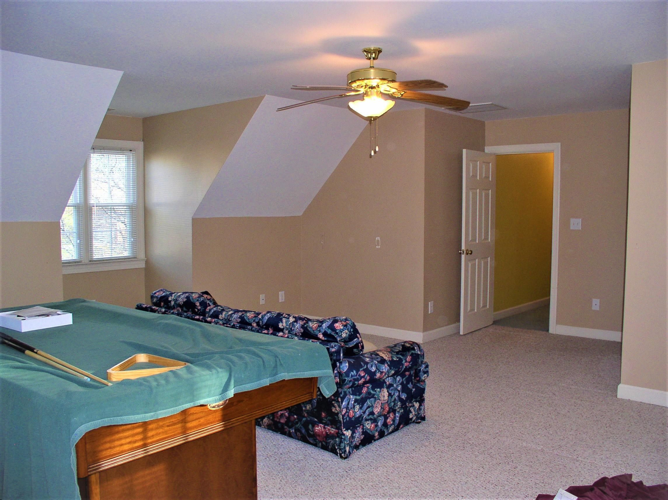 3516 Kapalua Way Raleigh, NC 27610 - Photo 33 of 42 a bed sitting in a bedroom next to a window