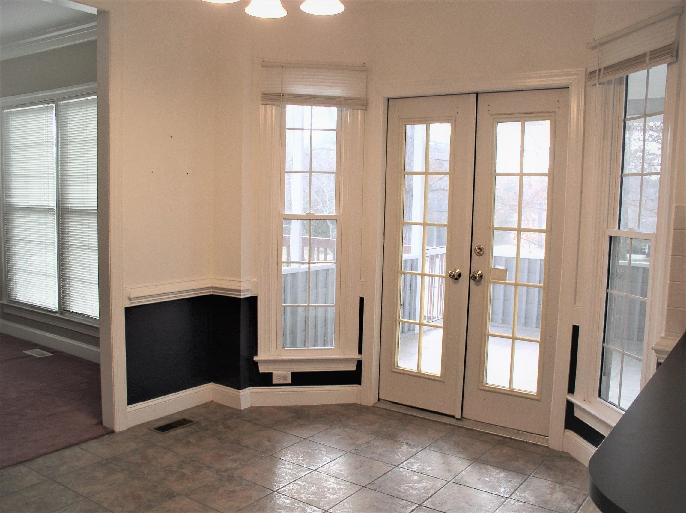 3516 Kapalua Way Raleigh, NC 27610 - Photo 6 of 42 a view of an empty room with a fireplace and a window