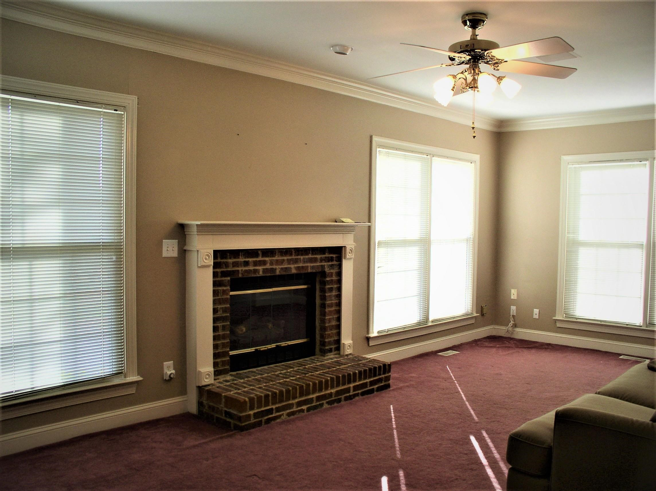 3516 Kapalua Way Raleigh, NC 27610 - Photo 10 of 42 a living room with furniture and a fireplace