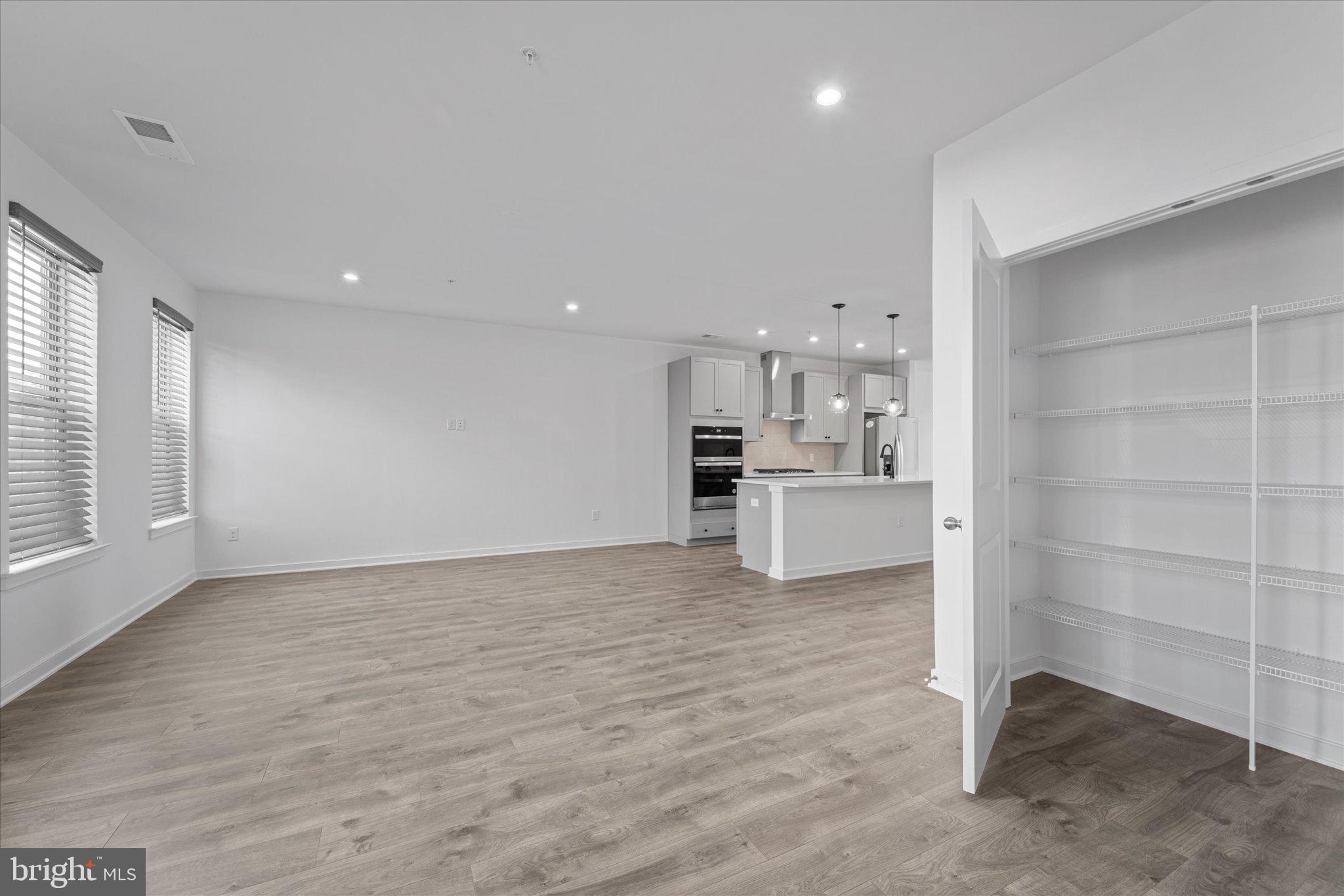 46207 Woodpecker Square Sterling, VA 20165 - Photo 13 of 37 a view of a kitchen with a sink and dishwasher cabinets