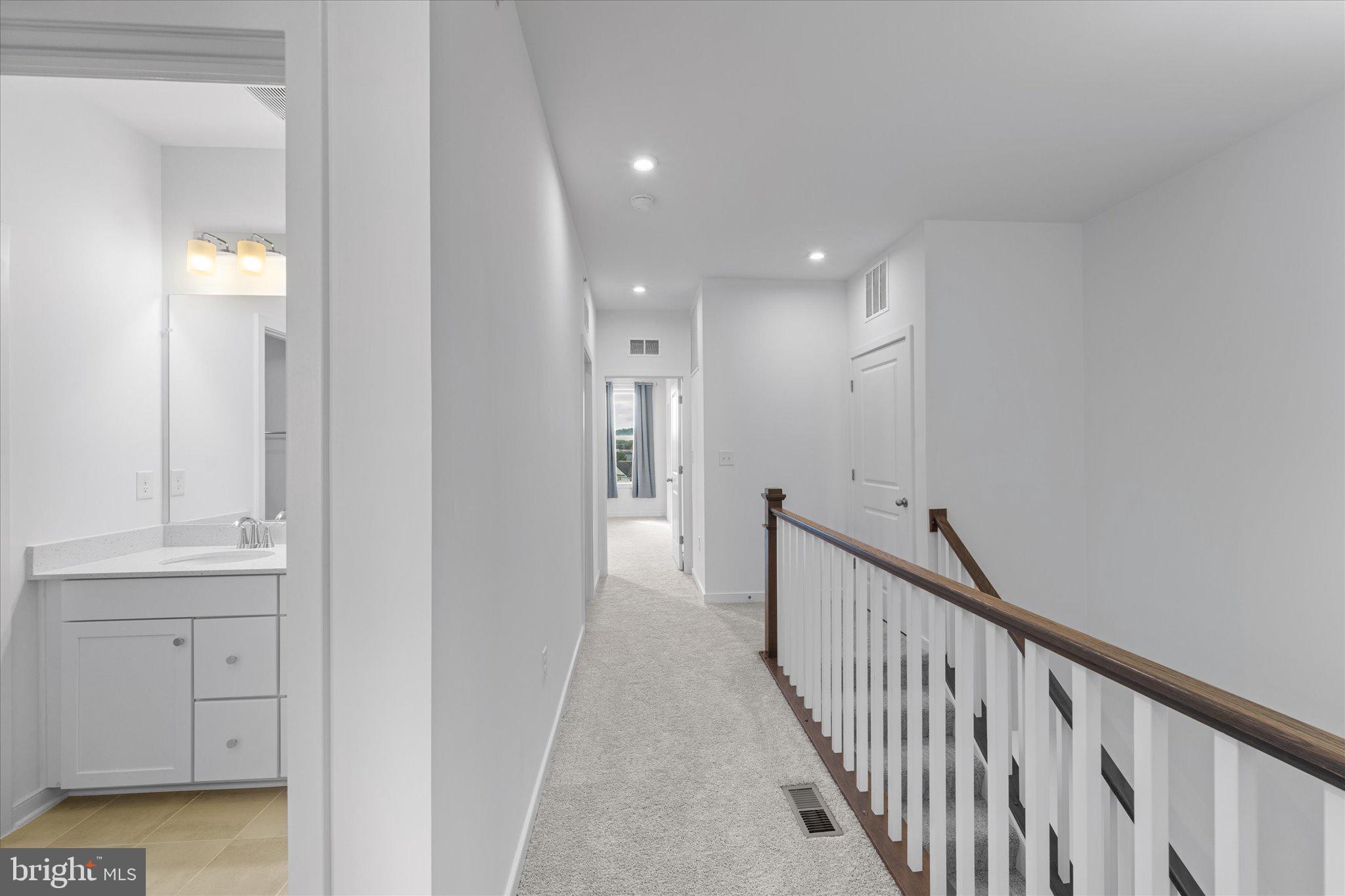 46207 Woodpecker Square Sterling, VA 20165 - Photo 16 of 37 a view of a hallway with wooden floor