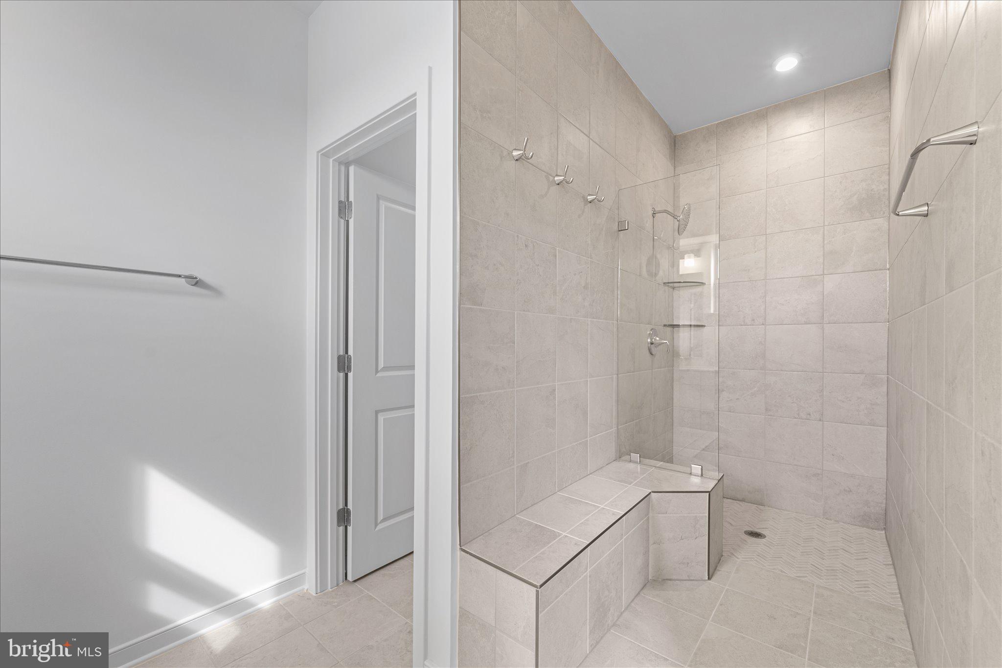 46207 Woodpecker Square Sterling, VA 20165 - Photo 19 of 37 a bathroom with a bathtub and shower