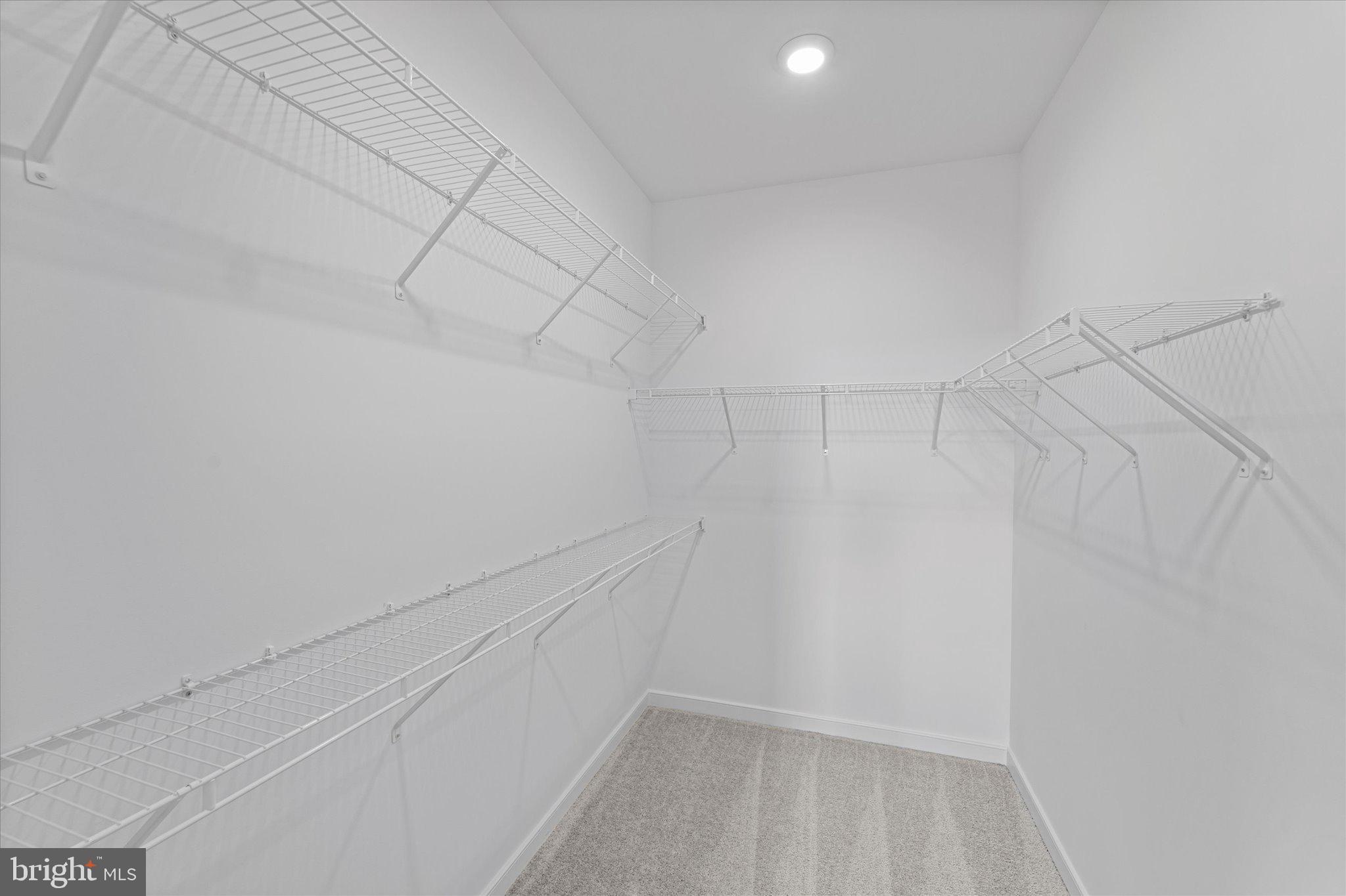 46207 Woodpecker Square Sterling, VA 20165 - Photo 21 of 37 a view of a room with racks on the wall