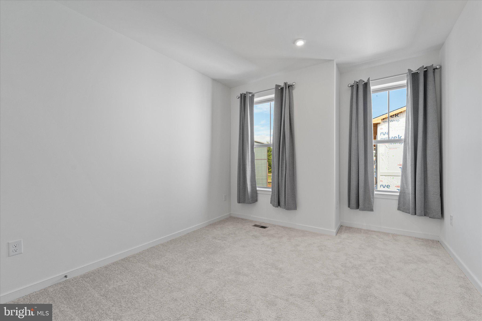 46207 Woodpecker Square Sterling, VA 20165 - Photo 24 of 37 an empty room with windows and closet