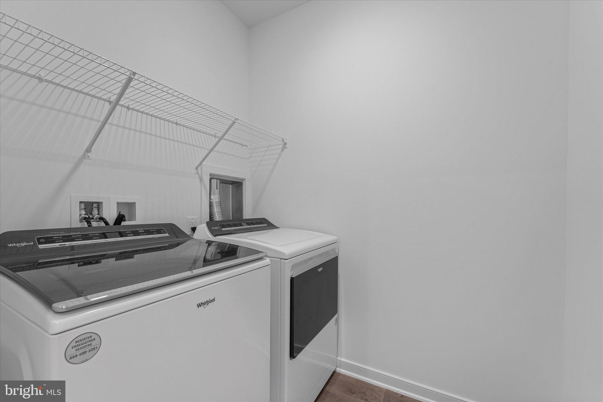 46207 Woodpecker Square Sterling, VA 20165 - Photo 30 of 37 a view of storage and utility room with washer and dryer