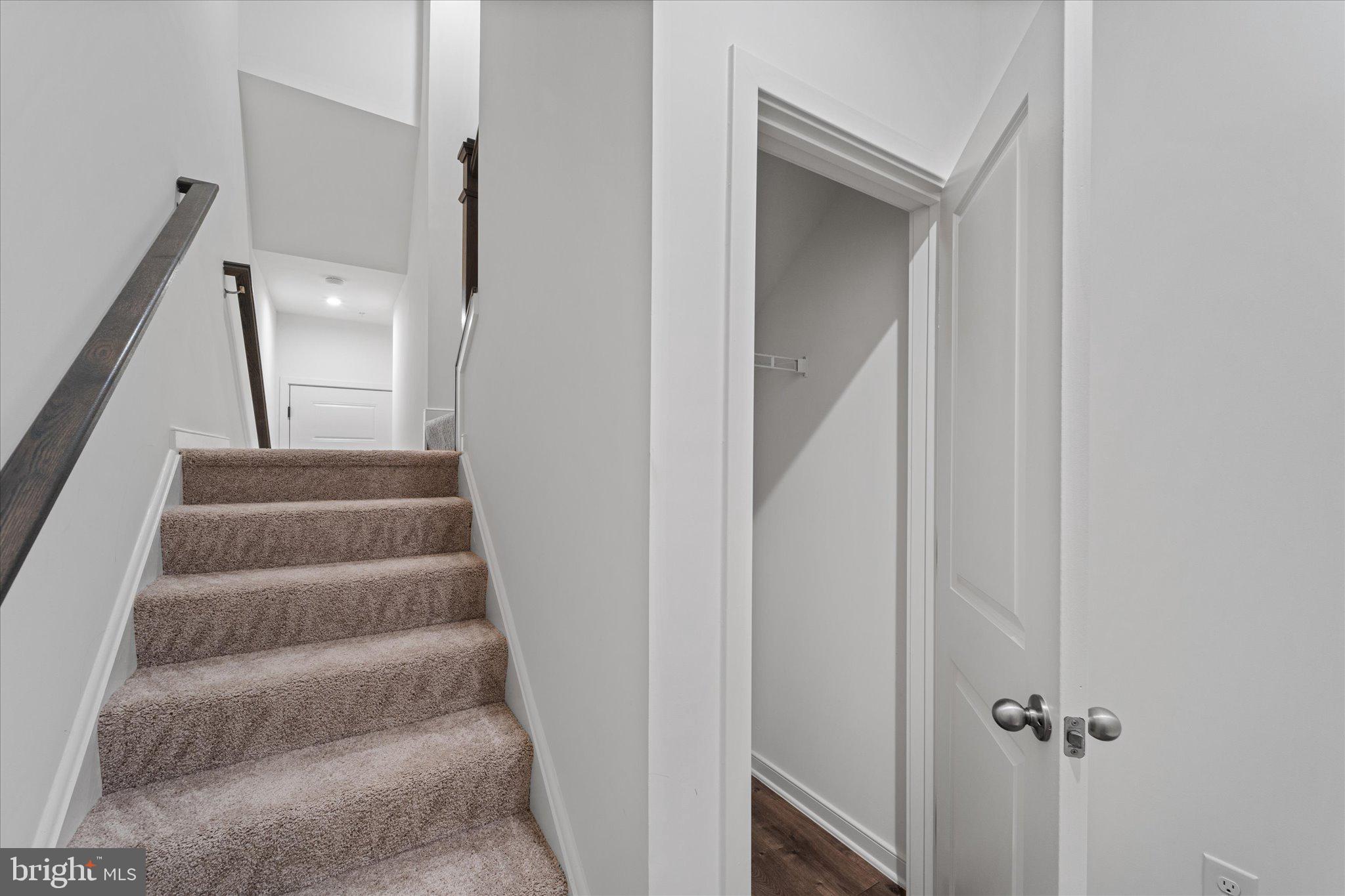 46207 Woodpecker Square Sterling, VA 20165 - Photo 3 of 37 a view of staircase with white walls