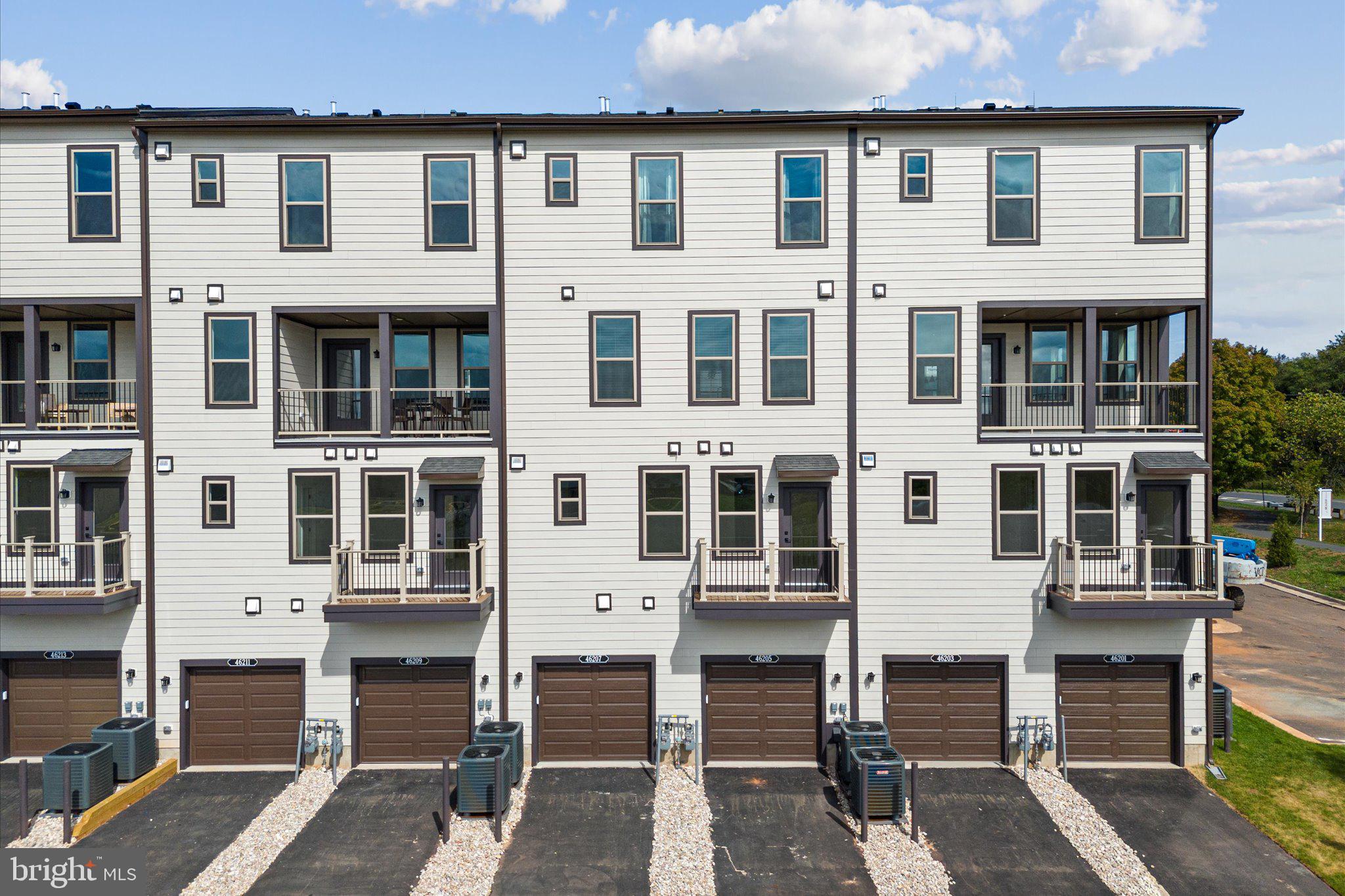 46207 Woodpecker Square Sterling, VA 20165 - Photo 31 of 37 a view of a building with a outdoor space