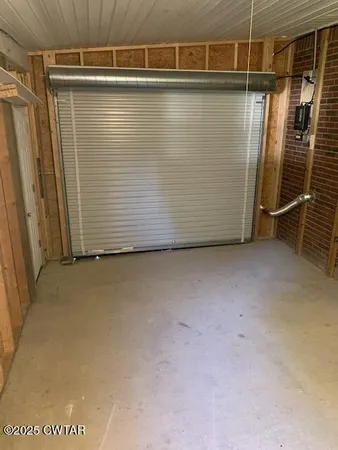 a view of a room with wooden walls