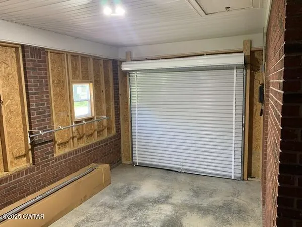 a view of a room with a large window