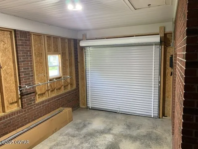 a view of a room with a large window