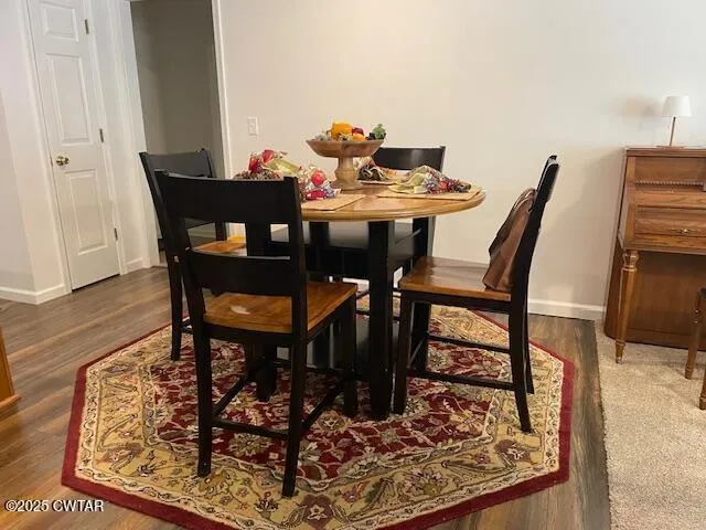 a kitchen with stainless steel appliances granite countertop a stove top oven a sink dishwasher and cabinets with wooden floor