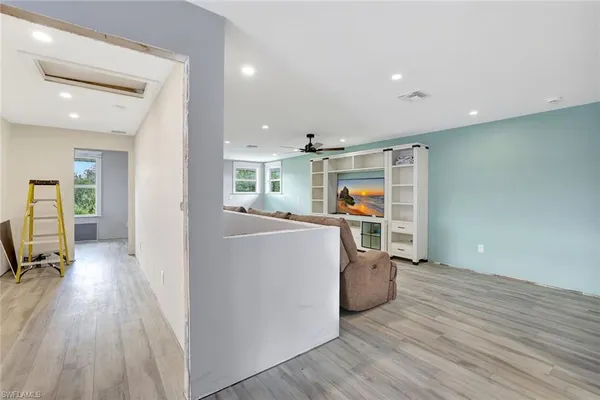 a view of kitchen with furniture and wooden floor