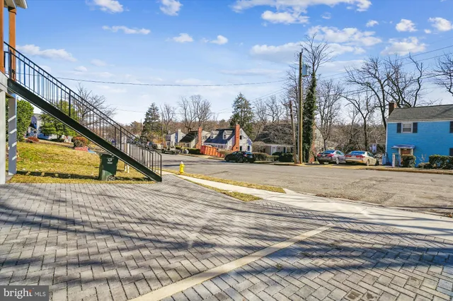 a view of a house with a garage and a chair