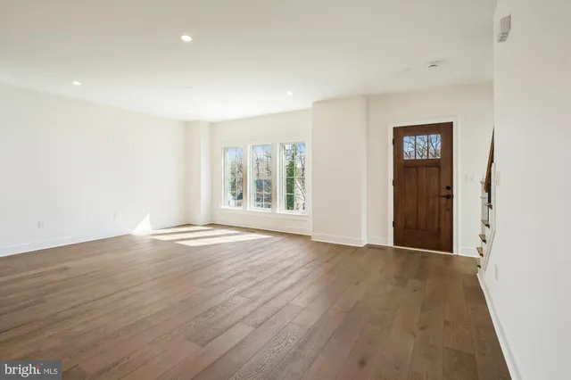 a kitchen with a white wooden cabinets and sink