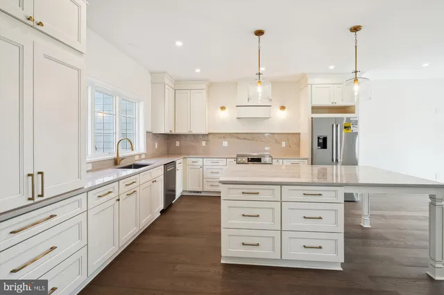 a large kitchen with granite countertop lots of counter top space