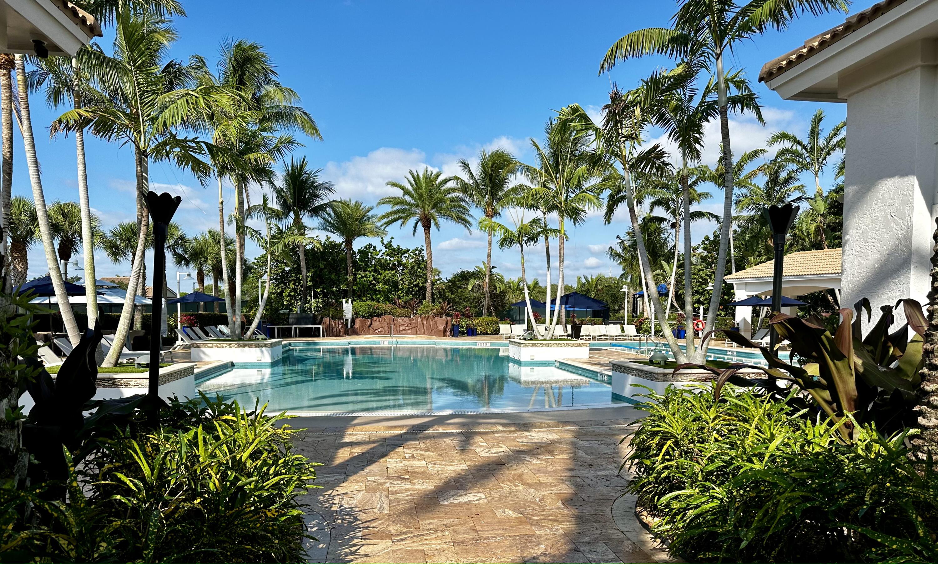 4792 Bocaire Boulevard Boca Raton, FL 33487 - Photo 46 of 60 a view of a backyard of a house with a patio