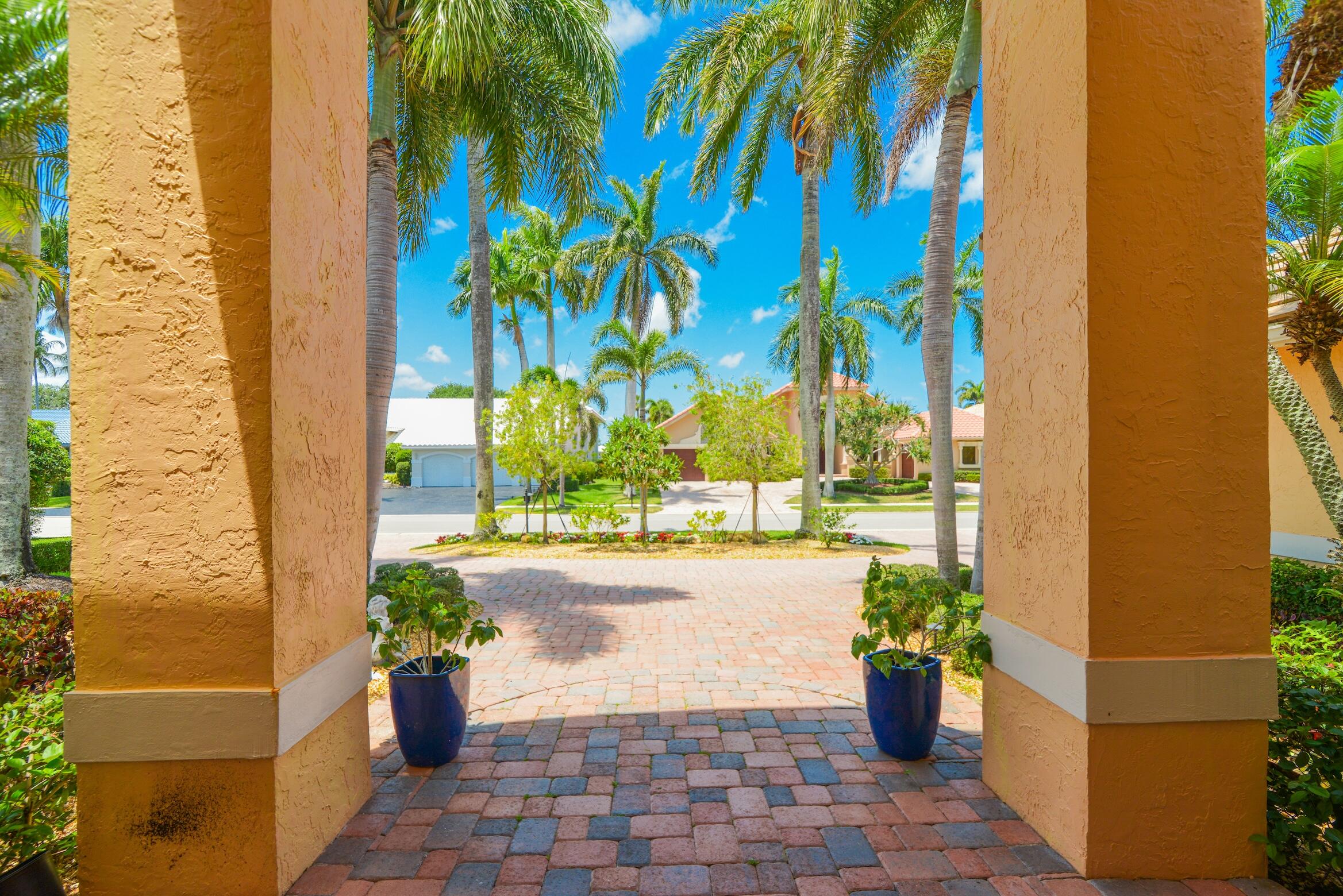 4792 Bocaire Boulevard Boca Raton, FL 33487 - Photo 6 of 60 a view of a pathway with a potted plants