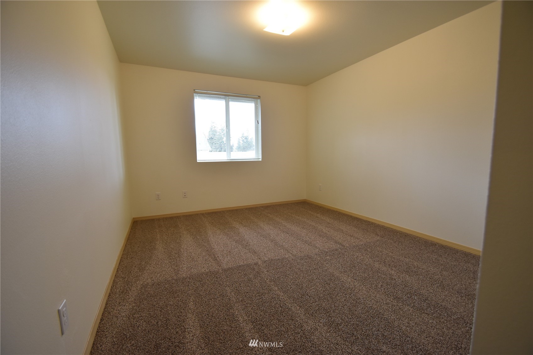 6346 198th Trail Southwest Rochester, WA 98579 - Photo 11 of 16 an empty room with a window