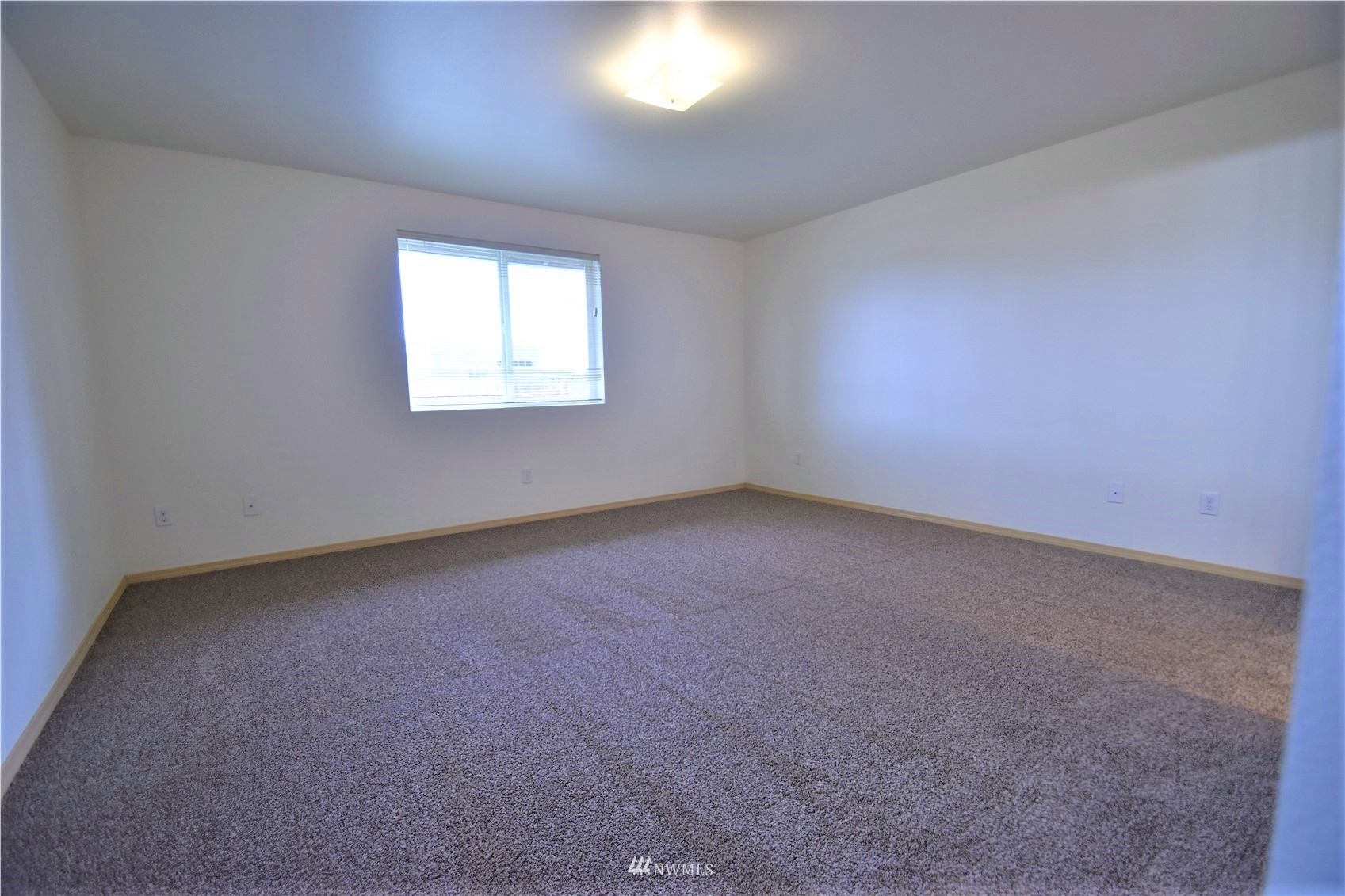 6346 198th Trail Southwest Rochester, WA 98579 - Photo 7 of 16 an empty room with a window