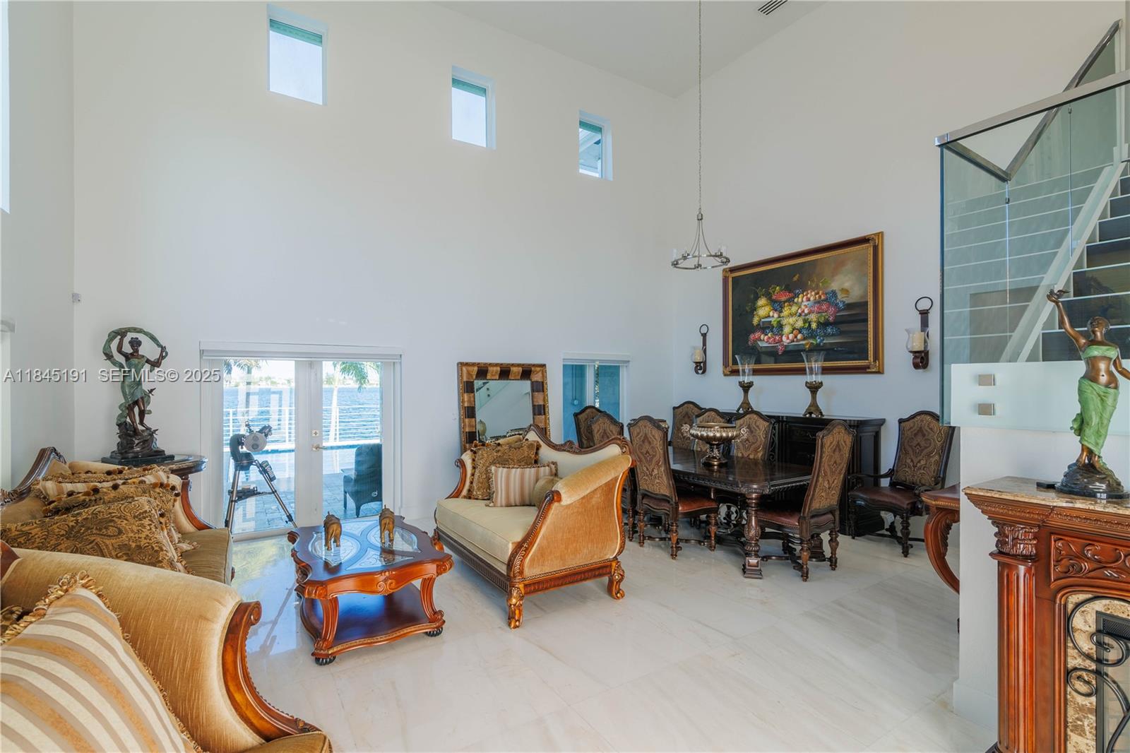 13731 Southwest 136th Place Miami, FL 33186 - Photo 13 of 94 a living room with furniture and a flat screen tv