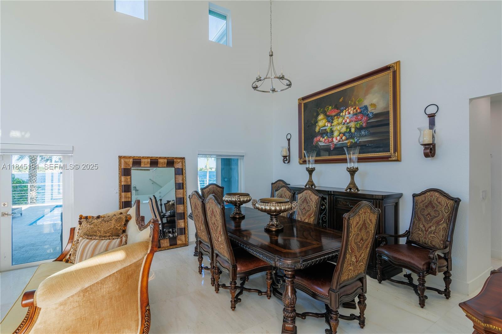 13731 Southwest 136th Place Miami, FL 33186 - Photo 18 of 94 a view of a livingroom with furniture and a flat screen tv