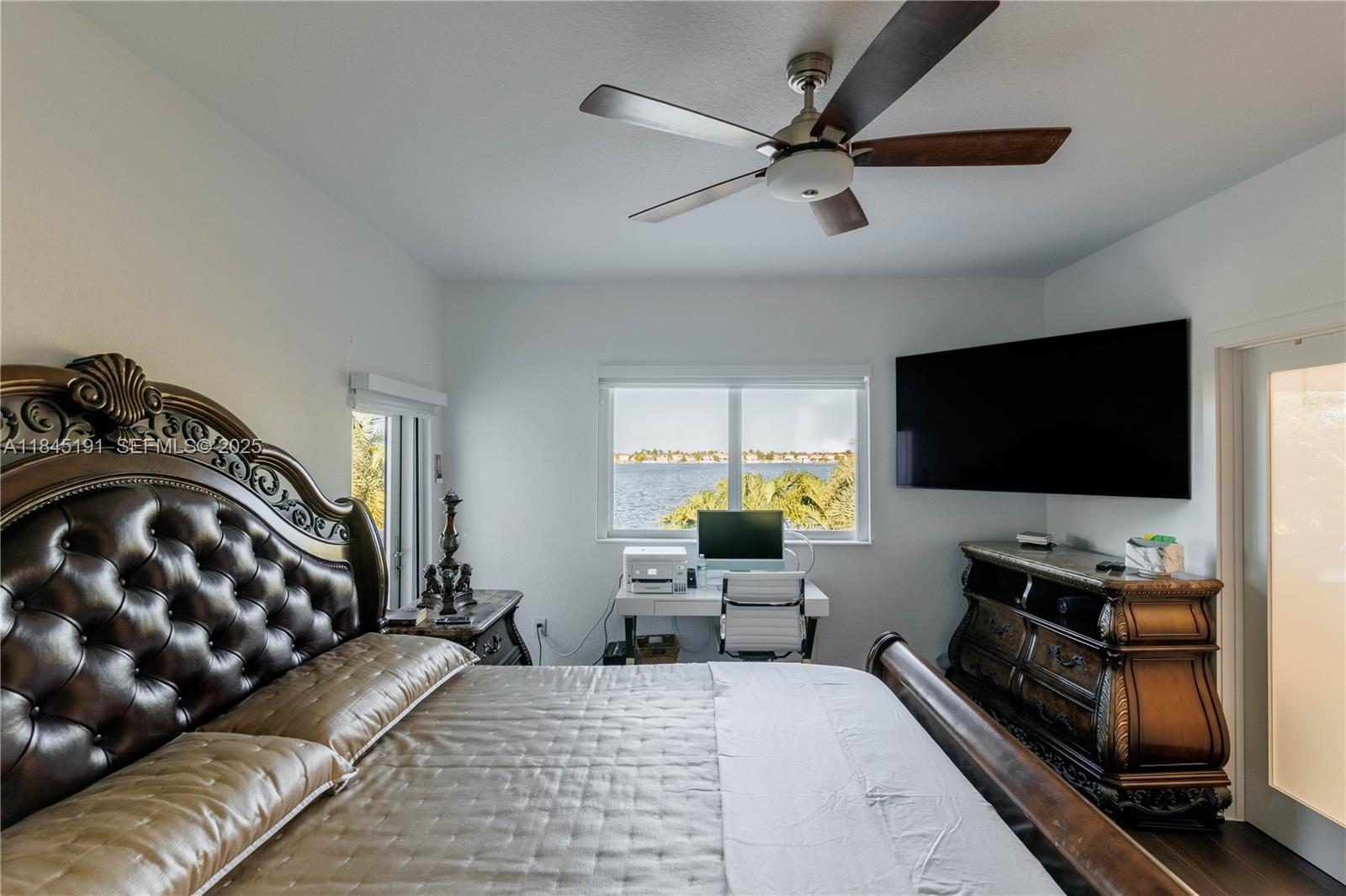 13731 Southwest 136th Place Miami, FL 33186 - Photo 74 of 94 a living room with furniture and a flat screen tv