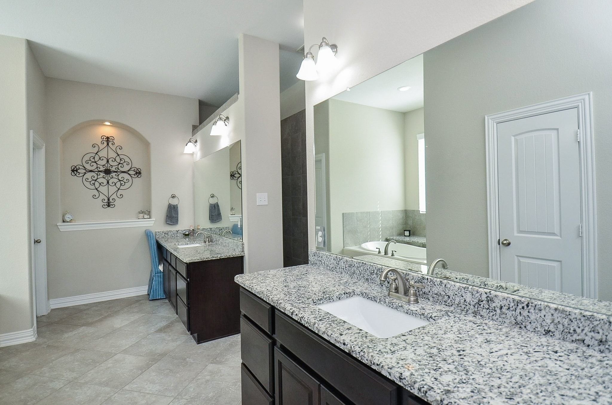 2714 Topaz Cove Lane Rosharon, TX 77583 - Photo 27 of 50 a bathroom with a granite countertop sink and a mirror