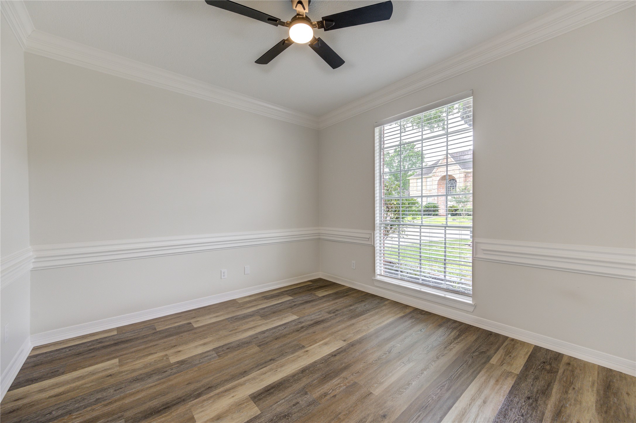 17318 Bonnard Circle Spring, TX 77379 - Photo 10 of 45 This home office is ideal if you work from home. The room is large enough for a credenza, desk and other office equipment. All rooms include new, modern, remote-controlled ceiling fans, and 2-inch window blinds.