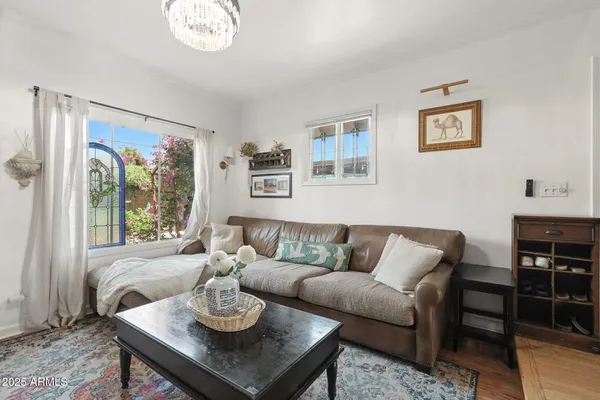 a living room with furniture and a window