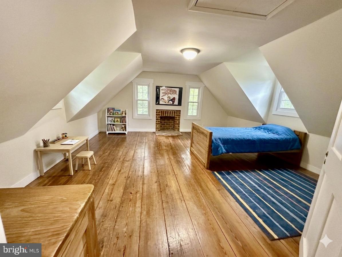 2349 Skinkers Neck Road Rappahannock Academy, VA 22538 - Photo 62 of 71 a living room with furniture and a wooden floor