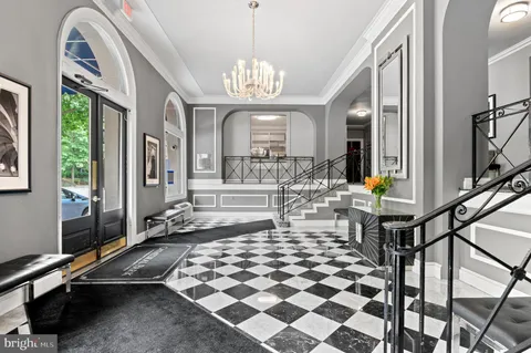 a lobby with a chandelier and living room