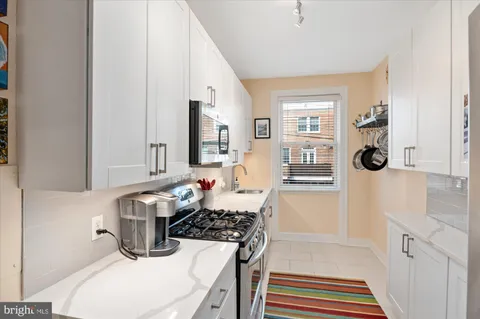a bathroom with a sink a mirror and a shower