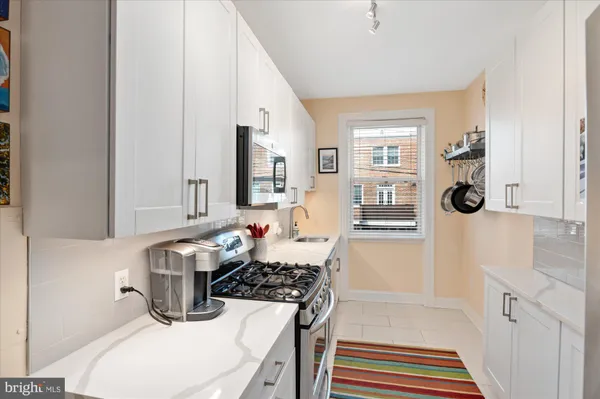 a bathroom with a sink a mirror and a shower