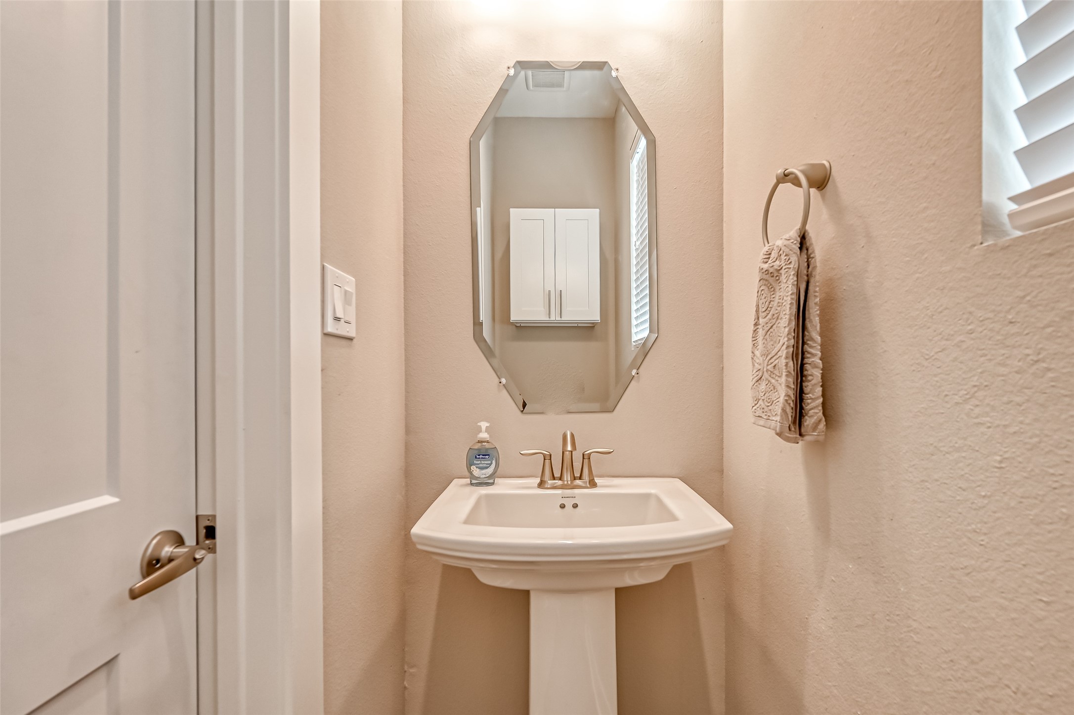 882 Fortune Street Houston, TX 77088 - Photo 17 of 18 a bathroom with a sink and mirror