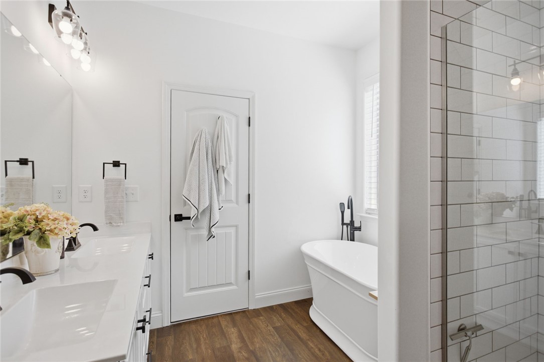 525 16th Circle Walhalla, SC 29691 - Photo 44 of 50 This serene bathroom offers a spacious soaking tub and an elegant walk-in shower for ultimate relaxation.
